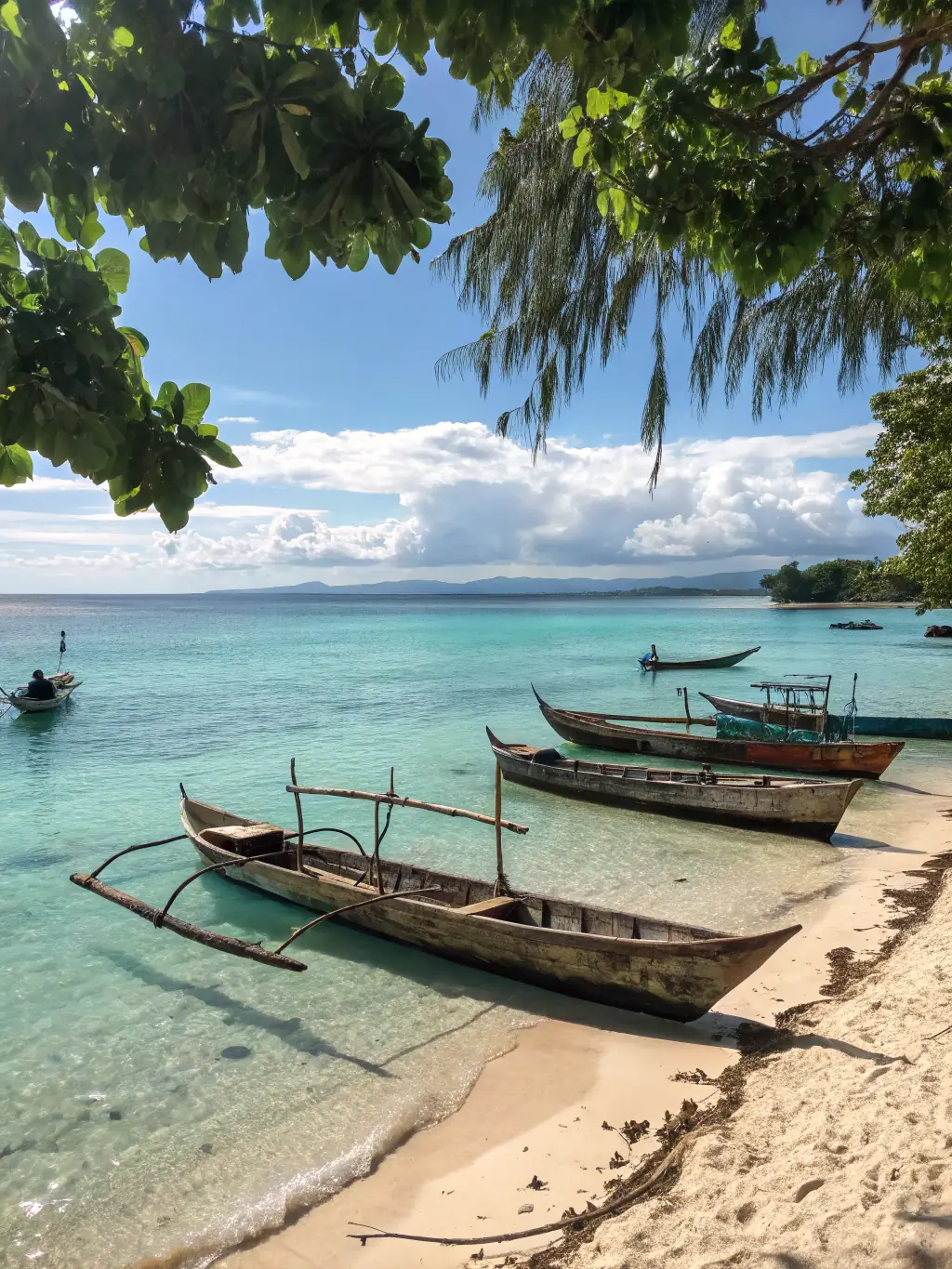 A scenic image of a traditional Malagasy pirogue sailing along the coast of Nosy Be at sunset, capturing the essence of the sailing tour.